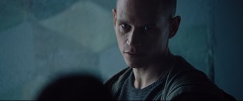 Movie still from “Jason Bourne” (2016), directed by Paul Greengrass – A person wearing a shirt; Close Up shot, Low angle