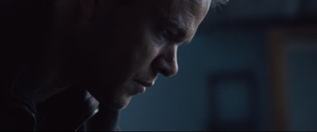 Movie still from “Jason Bourne” (2016), directed by Paul Greengrass – A man's face in the dark; Close Up shot, Low angle