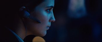 Movie still from “Jason Bourne” (2016), directed by Paul Greengrass – A person wearing a headset; Close Up shot, Low angle