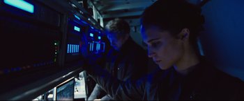Movie still from “Jason Bourne” (2016), directed by Paul Greengrass – A man and a woman are looking at a computer screen; Close Up shot, Low angle