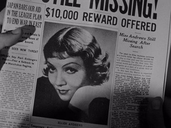 Movie still from “It Happened One Night” (1934), directed by Frank Capra – An old newspaper with a picture of an old woman; Extreme Close Up shot, Overhead angle