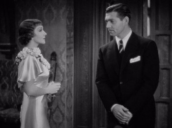 Movie still from “It Happened One Night” (1934), directed by Frank Capra – A man and a woman standing next to each other; Medium shot, Over the shoulder angle