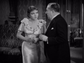 Movie still from “It Happened One Night” (1934), directed by Frank Capra – An old photo of a man and a woman talking; Medium shot, High angle