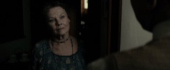 Movie still from “J. Edgar” (2011), directed by Clint Eastwood – An older woman is looking into the mirror; Close Up shot, Over the shoulder angle