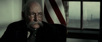 Movie still from “J. Edgar” (2011), directed by Clint Eastwood – An old man wearing a suit and a tie; Close Up shot, Low angle