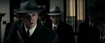 Movie still from “J. Edgar” (2011), directed by Clint Eastwood – A group of men wearing hats and suits; Close Up shot, Low angle