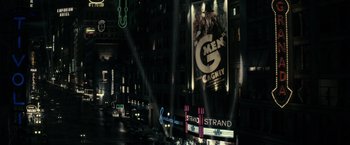 Movie still from “J. Edgar” (2011), directed by Clint Eastwood – A city street with a lot of lights on the side of the street; Extreme Wide shot, High angle