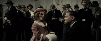 Movie still from “J. Edgar” (2011), directed by Clint Eastwood – A little girl in a pink coat and a man in a suit and tie; Medium shot, Low angle