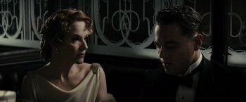 Movie still from “J. Edgar” (2011), directed by Clint Eastwood – A man and a woman sitting next to each other; Close Up shot, Low angle
