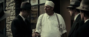 Movie still from “J. Edgar” (2011), directed by Clint Eastwood – A man in a white hat and a man in a black hat; Medium shot, Over the shoulder angle