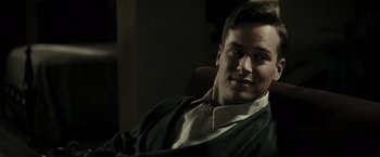 Movie still from “J. Edgar” (2011), directed by Clint Eastwood – A person sitting in a chair; Close Up shot, Over the shoulder angle