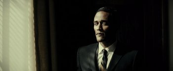 Movie still from “J. Edgar” (2011), directed by Clint Eastwood – A person wearing a suit and tie; Close Up shot, Low angle