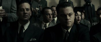 Movie still from “J. Edgar” (2011), directed by Clint Eastwood – A group of men standing next to each other in suits; Close Up shot, Low angle