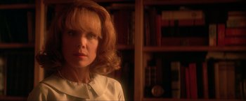 Movie still from “JFK” (1991), directed by Oliver Stone – A person wearing a white shirt; Close Up shot, Low angle