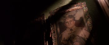Movie still from “JFK” (1991), directed by Oliver Stone – An old picture of a man wearing a crown; Extreme Close Up shot, Low angle