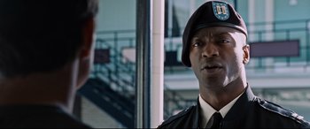 Movie still from “Jack Reacher: Never Go Back” (2016), directed by Edward Zwick – A man in a uniform talking to another man; Close Up shot, Low angle