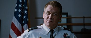 Movie still from “Jack Reacher: Never Go Back” (2016), directed by Edward Zwick – A person wearing a uniform; Close Up shot, Low angle