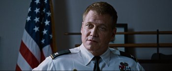 Movie still from “Jack Reacher: Never Go Back” (2016), directed by Edward Zwick – A person wearing a military uniform; Close Up shot, Low angle