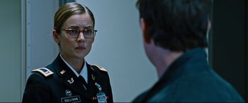 Movie still from “Jack Reacher: Never Go Back” (2016), directed by Edward Zwick – A woman in a military uniform talking to a man in glasses; Close Up shot, Over the shoulder angle