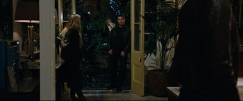 Movie still from “Jack Reacher: Never Go Back” (2016), directed by Edward Zwick – A man and a woman standing in front of an open door; Wide shot, Over the shoulder angle