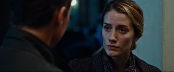 Movie still from “Jack Reacher: Never Go Back” (2016), directed by Edward Zwick – A woman looking at another woman in a suit; Close Up shot, Over the shoulder angle
