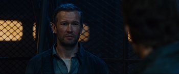 Movie still from “Jack Reacher: Never Go Back” (2016), directed by Edward Zwick – A person wearing a blue shirt; Close Up shot, Over the shoulder angle