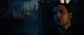 Movie still from “Jack Reacher: Never Go Back” (2016), directed by Edward Zwick – A man sitting in a chair in a dark room; Close Up shot, High angle