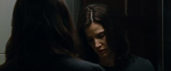 Movie still from “Jack Reacher: Never Go Back” (2016), directed by Edward Zwick – A person looking at a mirror; Close Up shot, Over the shoulder angle