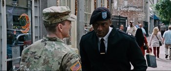 Movie still from “Jack Reacher: Never Go Back” (2016), directed by Edward Zwick – A man in a military uniform talking to another man in a uniform; Medium shot, Over the shoulder angle