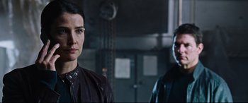 Movie still from “Jack Reacher: Never Go Back” (2016), directed by Edward Zwick – A woman standing next to a man in a room; Close Up shot, Over the shoulder angle