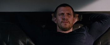 Movie still from “Jack Reacher: Never Go Back” (2016), directed by Edward Zwick – A person sitting in a chair; Close Up shot, Low angle