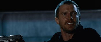 Movie still from “Jack Reacher: Never Go Back” (2016), directed by Edward Zwick – A person with a beard; Close Up shot, Over the shoulder angle