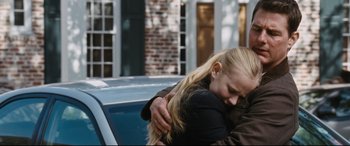 Movie still from “Jack Reacher: Never Go Back” (2016), directed by Edward Zwick – A woman hugging a man in front of a car; Medium shot, Over the shoulder angle
