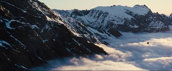 Movie still from “Jack Ryan: Shadow Recruit” (2014), directed by Kenneth Branagh – A view of a mountain range with snow on it's sides; Extreme Wide shot, High angle