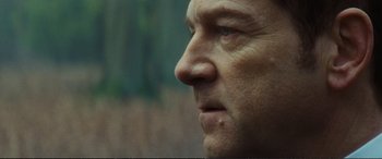 Movie still from “Jack Ryan: Shadow Recruit” (2014), directed by Kenneth Branagh – A man's face looking off into the distance; Extreme Close Up shot, Low angle