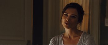 Movie still from “Jack Ryan: Shadow Recruit” (2014), directed by Kenneth Branagh – A beautiful young lady looking at the camera; Close Up shot, Over the shoulder angle