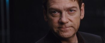 Movie still from “Jack Ryan: Shadow Recruit” (2014), directed by Kenneth Branagh – A man's face in a black shirt; Close Up shot, Low angle