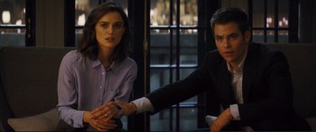 Movie still from “Jack Ryan: Shadow Recruit” (2014), directed by Kenneth Branagh – A man and a woman sitting in front of a window; Medium shot, Over the shoulder angle