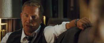 Movie still from “Jack Ryan: Shadow Recruit” (2014), directed by Kenneth Branagh – A person sitting on a chair; Close Up shot, Over the shoulder angle