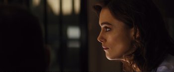 Movie still from “Jack Ryan: Shadow Recruit” (2014), directed by Kenneth Branagh – A woman's face in a dark room; Close Up shot, Over the shoulder angle