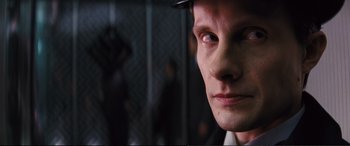 Movie still from “Jack Ryan: Shadow Recruit” (2014), directed by Kenneth Branagh – A person wearing a hat; Close Up shot, Low angle