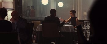 Movie still from “Jack Ryan: Shadow Recruit” (2014), directed by Kenneth Branagh – A man and a woman sitting at a dinner table; Medium shot, Over the shoulder angle