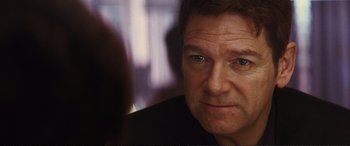 Movie still from “Jack Ryan: Shadow Recruit” (2014), directed by Kenneth Branagh – A man's face in front of a mirror; Close Up shot, Over the shoulder angle
