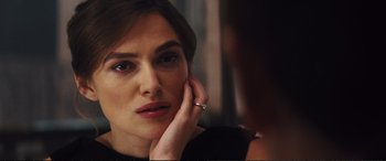 Movie still from “Jack Ryan: Shadow Recruit” (2014), directed by Kenneth Branagh – A person wearing a ring looking in a mirror; Close Up shot, Over the shoulder angle