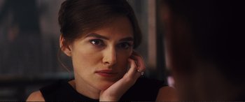 Movie still from “Jack Ryan: Shadow Recruit” (2014), directed by Kenneth Branagh – A person with her hand on her face; Close Up shot, Over the shoulder angle