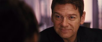 Movie still from “Jack Ryan: Shadow Recruit” (2014), directed by Kenneth Branagh – A person looking at the camera; Close Up shot, Over the shoulder angle
