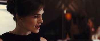 Movie still from “Jack Ryan: Shadow Recruit” (2014), directed by Kenneth Branagh – A woman's face in a black dress; Close Up shot, Over the shoulder angle