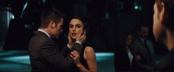 Movie still from “Jack Ryan: Shadow Recruit” (2014), directed by Kenneth Branagh – A man and a woman dancing in a dark room; Close Up shot, Over the shoulder angle