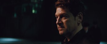 Movie still from “Jack Ryan: Shadow Recruit” (2014), directed by Kenneth Branagh – A person looking at the camera; Close Up shot, Over the shoulder angle