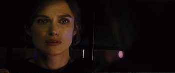 Movie still from “Jack Ryan: Shadow Recruit” (2014), directed by Kenneth Branagh – A woman's face in the dark; Close Up shot, Over the shoulder angle